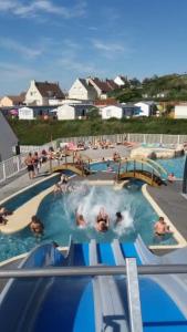 a group of people in a swimming pool at camping de la falaise à equihen plage in Équihen-Plage