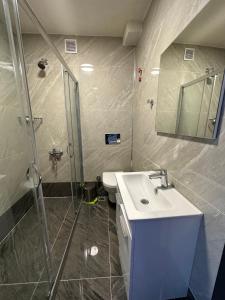 a bathroom with a sink and a shower at Terrace Guesthouse in Istanbul