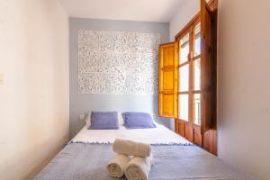 A bed or beds in a room at Apartamento Ilusión Andaluza