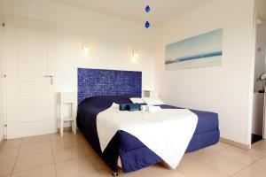 Giường trong phòng chung tại Chambres d'hôtes - Villa CARPE DIEM TOLOSA +31 ảnh