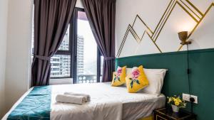 a bedroom with a bed with a large window at Arte Plus Jalan Ampang by Airhost in Kuala Lumpur