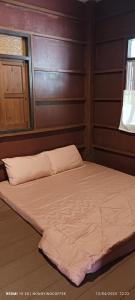 Postel nebo postele na pokoji v ubytování Chanmuang guesthouse