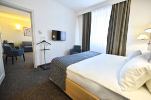 Letto o letti in una camera di Europe Hotel