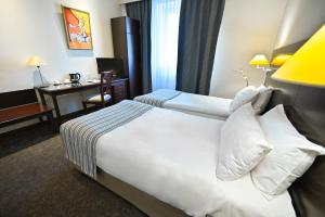 Letto o letti in una camera di Europe Hotel