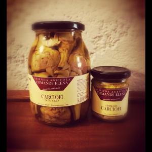 two jars of peanuts sitting next to each other at Pian di Rocca Country in Castiglione della Pescaia