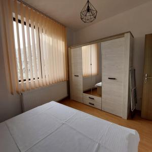 Giường trong phòng chung tại Rio Apartament