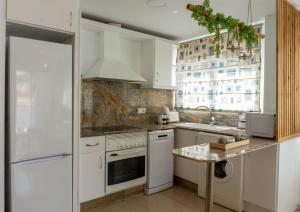 Kuchyňa alebo kuchynka v ubytovaní Apartamento mediterráneo en pleno corazón de Moraira