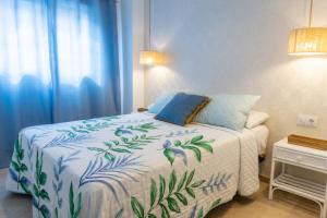 Posteľ alebo postele v izbe v ubytovaní Apartamento mediterráneo en pleno corazón de Moraira