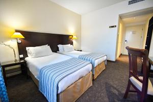 Letto o letti in una camera di Europe Hotel