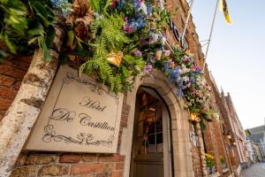 a building with flowers on the side of it at Boutique Hotel De Castillion - Small elegant family hotel in Bruges