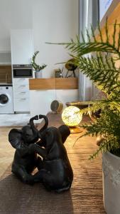two elephant statues sitting on a table in a kitchen at Brand New sunny apartment on Andrássy street in Budapest