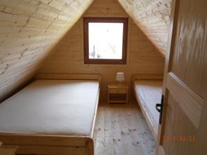 Postel nebo postele na pokoji v ubytování Zrubovy dom Silvia