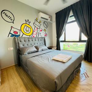 a bedroom with a bed with cartoon characters on the wall at GELANG PATAH Forest City-Ataraxia Park 3 in Gelang Patah