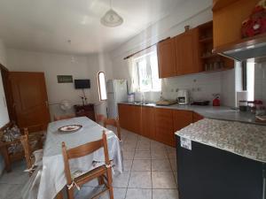 Kuchyň nebo kuchyňský kout v ubytování Happy Days Apartment