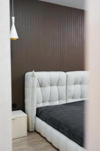 a white couch in a room with a table at NL group apartments in Kolomiya