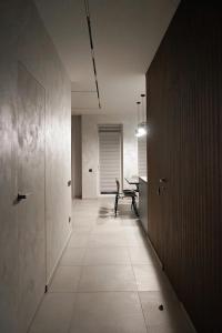 a hallway with a table and a bench in a room at NL group apartments in Kolomiya
