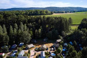 an aerial view of a farm with a group of tents at Glamping the Vosges in Corcieux