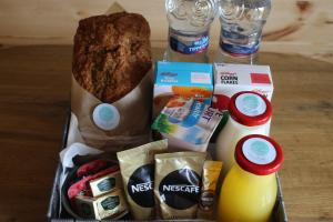 a tray with some food and some drinks and bread at Sea Crest Pods in Rossnowlagh