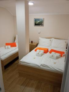 Postel nebo postele na pokoji v ubytování Apartmani Jela Tara
