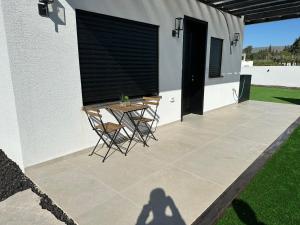 a shadow of a person standing on a patio at צימר פסטורלי בהגושרים in Hagoshrim