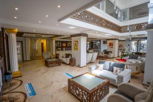 a large living room with couches and a table at Mevre Hotel in Antalya