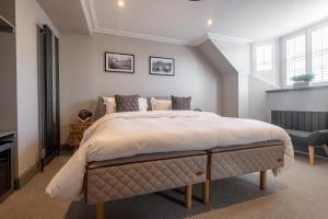 a bedroom with a large bed in a room at The Arran, St Andrews in St. Andrews