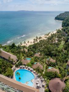 an aerial view of a resort with a swimming pool and the beach at Cape Panwa Hotel Phuket - SHA Plus Certified in Panwa Beach