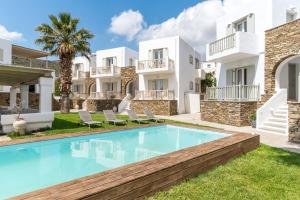 an image of a villa with a swimming pool at Ninemia Suites Tinos Superior 201 in Kionia