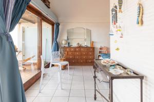 a kitchen with a table in a room at Rooftop front de mer in Saint-Cyprien