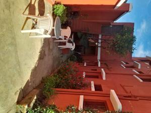 a group of chairs sitting on the side of a building at K6 Chambres d'Hôte in Ivato