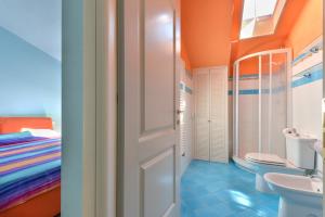a bathroom with a toilet and a sink at Casa Minnie in Cavo +15 photos