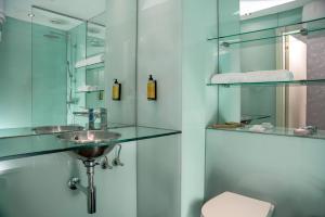 a bathroom with a sink and a toilet at Mitico Hotel & Natural Spa in Bologna