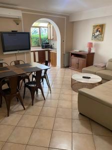 a living room with a couch and a table at Apartments Oliva in Poreč
