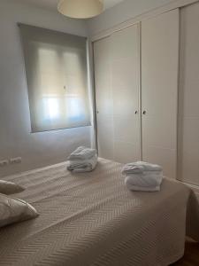 Posteľ alebo postele v izbe v ubytovaní ático con terraza- solarium + 6 fotografií