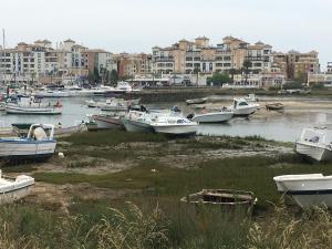 a group of boats in a harbor with buildings at Dúplex en punta del moral in Isla del Moral