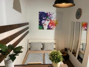 A bed or beds in a room at Parliament Studio