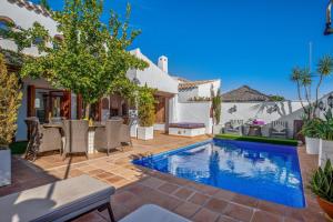 a swimming pool in the backyard of a house at 7 bedroom Villa for 15 ppl Heated pool, sauna, hot tub on El Valle Golf, Murcia 