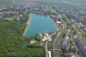 an aerial view of a lake in a city at Lake apartment, 2x free garage, 10 mins to centre in Bratislava