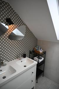 a bathroom with a white sink and a mirror at Krakovska apartments in Ljubljana +35 photos