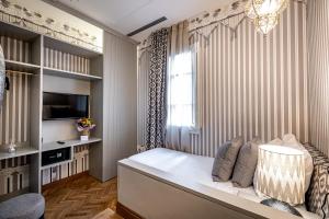 Postel nebo postele na pokoji v ubytování Hotel Duomo Firenze