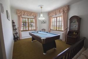 a room with a pool table in the middle of it at Catalunya Casas Close to Salou and just steps from the village! in Alcover