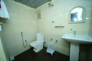 Koupelna v ubytování Prakruth Backwater Stay By Lazo , Coorg