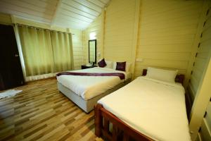 Postel nebo postele na pokoji v ubytování Prakruth Backwater Stay By Lazo , Coorg + 12 fotografií