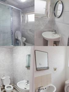 a bathroom with a sink toilet and a mirror at holiday home in Manchester