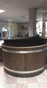 a large wooden bar in a lobby with a counter at Ptasia Zatoka in Augustów