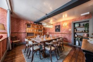 a dining room with a table and chairs at The Feathers Holt in Holt