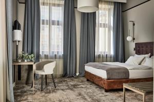 Posteľ alebo postele v izbe v ubytovaní Hotel Unicus Krakow Old Town - Destigo Hotels