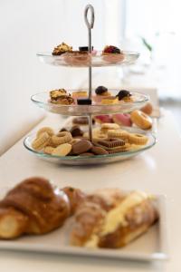 a plate of different types of pastries and cookies at Hotel The Sea in Rimini