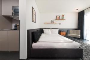 Ένα ή περισσότερα κρεβάτια σε δωμάτιο στο Brera Serviced Apartments Munich Schwabing