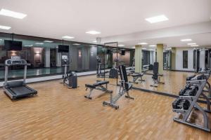 a gym with several treadmills and exercise machines at Wyndham Garden San Jose Escazu, Costa Rica in San José